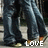 Pixelated image of two figures in dark clothing with light-colored shoes, one figure holding a white object, text 'LOVE' at bottom right.