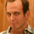 A contact sheet of two animated frames from an AOL Instant Messenger buddy icon featuring a man in a checkered shirt and a red house with "ARRESTED DEVELOPMENT" text above it.