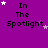 Purple background with black text "In The Spotlight" and white/pink star shapes scattered across the image.