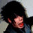 Pixelated image of a person with dark hair in three distinct poses showing facial expressions and background variations.