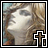 Pixelated image of a pale figure with closed eyes amid blurred trees, featuring a brown cross symbol in the bottom-right corner.