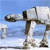 A pixelated bipedal robot with a cylindrical body, four legs, and a single arm extends from a light blue sky background.