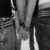 Black-and-white pixelated image showing vertical and horizontal lines with varying grayscale tones, no distinct subjects or text visible.