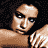 Pixelated image of a person in a white bra top, showing multiple poses with arms crossed and head turned, on a black background with 'Coolbuddy.com' text.