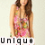 A pixelated image of a person with long brown hair wearing a colorful floral-patterned top, with the word 'unique' displayed below in black block letters.