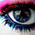 A four- of pixelated images: a close-up eye with blue and black tones, a pink starry background with red text, colorful hearts on white, and a striped background with text