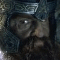 A pixelated image of a bearded figure with a helmet and a blue-framed object resembling a key or tool on a black background.