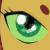 A pixelated close-up of a green eye with a black pupil and white highlights, set against a yellowish background with a small brown spot.