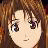 A pixelated anime-style character face with brown hair and large eyes on the left, next to a black background with white text "Anime IM" above smaller stylized text "cOm" on the right.
