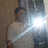 A static image shows a person in a white shirt with a bright flash, surrounded by blue text on a green background.