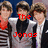 Group of six young men in matching silver and black outfits with striped sleeves, standing against a blue background with red text labels.