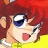 Pixelated anime-style character with red hair and blue eyes, wearing yellow top and white necklace, mouth open in surprise, next to black background with white text.