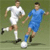 Pixelated static image of two soccer players in mid-action on a green field, one in white uniform and the other in blue uniform with a visible soccer ball at their feet.