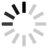 Circular loading spinner with alternating light and dark segments rotating clockwise on gray background.