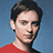 Pixelated image of a person in red shirt against blue background with bold red text reading 'He Is... secretly SPIDERMAN! shhh' on right.