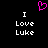 Pixelated pink heart symbol above white text reading "I Love Luke" in two identical vertical on black background