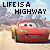 Red animated car character with smiling face on highway background, text "LIFE IS A HIGHWAY" above in black and red letters.