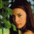 A 50x50 pixel animated buddy icon featuring a side-profile of a woman with long dark hair against green foliage on the left, and bright green text reading "Original Icons .com" on a solid dark green background on the right.