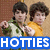 Two pixelated figures in green and yellow shirts stand side-by-side with a blue banner reading 'HOTTIES' below them.