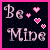 Pixelated 'Be Mine' text in light pink with four pink hearts on a black background, bordered by bright pink.