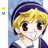 Animated icon of a blonde anime-style character with large brown eyes, wearing a dark blue headband and purple top with white collar.