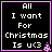 Black background with white pixelated text reading "All I want For Christmas Is u<3" and a pink border, with a small pink pixelated symbol in the bottom-right corner.