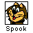 Pixelated cartoon character head with brown hair, yellow face, and black body inside a square frame above the text "Spook" on white background.