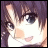 Pixelated anime-style character face with brown hair and large eyes, next to stylized text on black background.