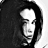 Black-and-white pixelated image of a person with long dark hair, showing two sequential poses with head turned left and right.
