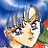 Pixelated anime-style character with blue hair and a golden tiara against a blue sky background, with text reading "AnimeIM" and "com" on a black
