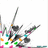 Pixelated abstract composition with dark gray and black shapes, scattered cyan green orange pink magenta dots on white background.