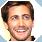 Pixelated static image of a person's face with brown hair, light skin tone, and visible facial features including eyes, nose, mouth, and beard stubble.