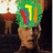 A pixelated image of a person with green hair and colorful highlights, wearing a brown top against a dark background.