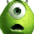 Static pixelated green cartoon character with single large eye, black mouth, and small antennae-like protrusions on top of head against white background.
