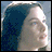 Pixelated image of a person with light hair against blue background, next to yellow text reading "LORD OF THE RINGS THE TWO TOWERS" on black.