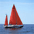 Pixelated static image of a sailboat with red sails on blue water under light blue sky.