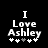 Black background with white pixelated text reading "I Love Ashley" and five plus signs below, where the third plus sign is gray in the first frame and white in the second frame.
