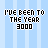 Pixelated text on a light blue striped background with a gray rectangle in the bottom right corner.