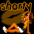 Pixelated cartoon character with orange hair and brown afro, standing on orange platform with white clouds, holding black object in speech bubble.