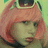 Pixelated image of a person with short pink hair and dark sunglasses on head, static pose against light green background.