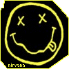 Yellow neon-style smiley face with X eyes and a curved mouth on black background, with 'nirvana' text in bottom-left corner.