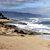 A 2x2 contact sheet of four animated frames showing a beach scene, the word 'LOST', broadcast timing text, and an ABC logo.