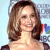 A pixelated image of a woman with shoulder-length brown hair smiling, wearing dark clothing against a light background with green text reading 'Original Icons .com' on the right.