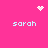 Pink background with four 'sarah' text instances and three pixelated symbols: a heart, starburst, and dot cluster.