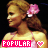 Pixelated side-profile image of a woman with blonde hair tied back, wearing pink floral hair accessory and light-colored top.