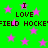 Green background with pink stars and repeated text 'I LOVE FIELD HOCKEY' in pixelated black font.