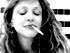 Black-and-white animated sequence showing a person with long hair holding a cigarette, alternating between closed eyes and open eyes with a cigarette in mouth.