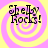 Four identical display "Shelly Rocks!" text over a yellow and pink spiral background with pixelated lettering
