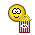 Yellow circular emoji face with pixelated eyes and mouth holding red-and-white striped popcorn bucket filled with yellow popcorn, displayed in a of frames showing sequential animation changes