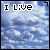 Pixelated text reads 'I Live With My Head In The Clouds' over a blue sky background with white clouds.